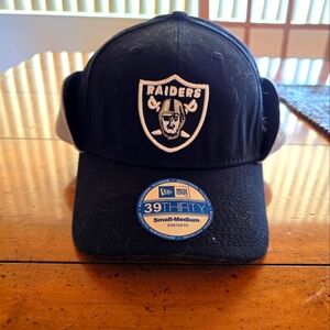 NEW Raiders winter cap with fleece ear flaps.